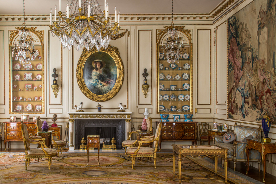 Opulent French drawing room with chandeliers, gilded furniture, and porcelain on display at Hillwood Estate in Washington, DC.