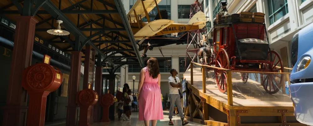 Visitors explore historic transportation displays inside the Smithsonian National Postal Museum.